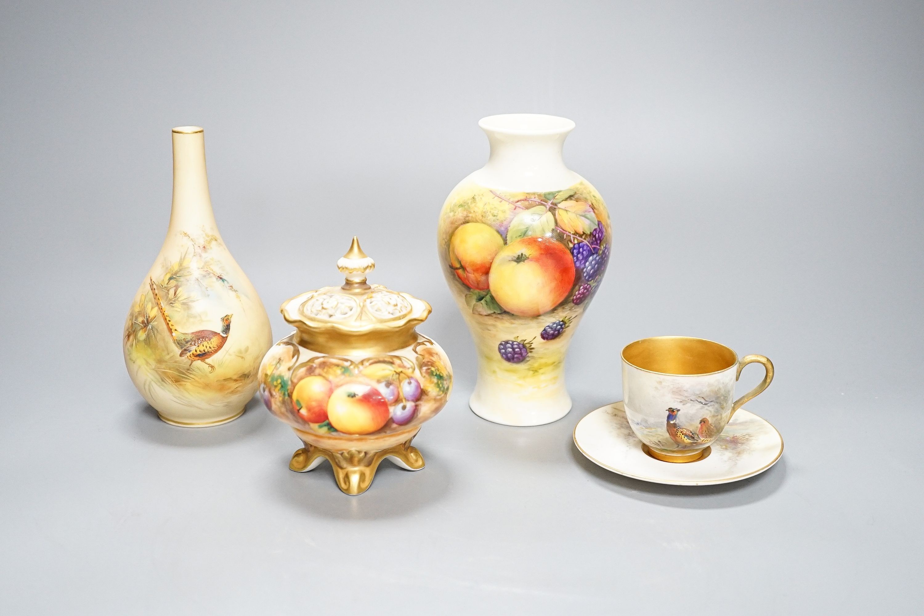 A Royal Worcester fruit painted small pot pourri and cover, 10.9cm high and a similar vase, 15cm, a Royal Worcester miniature cup and saucer, painted with pheasants, signed James Stinton and Grainger & Co pheasant vase